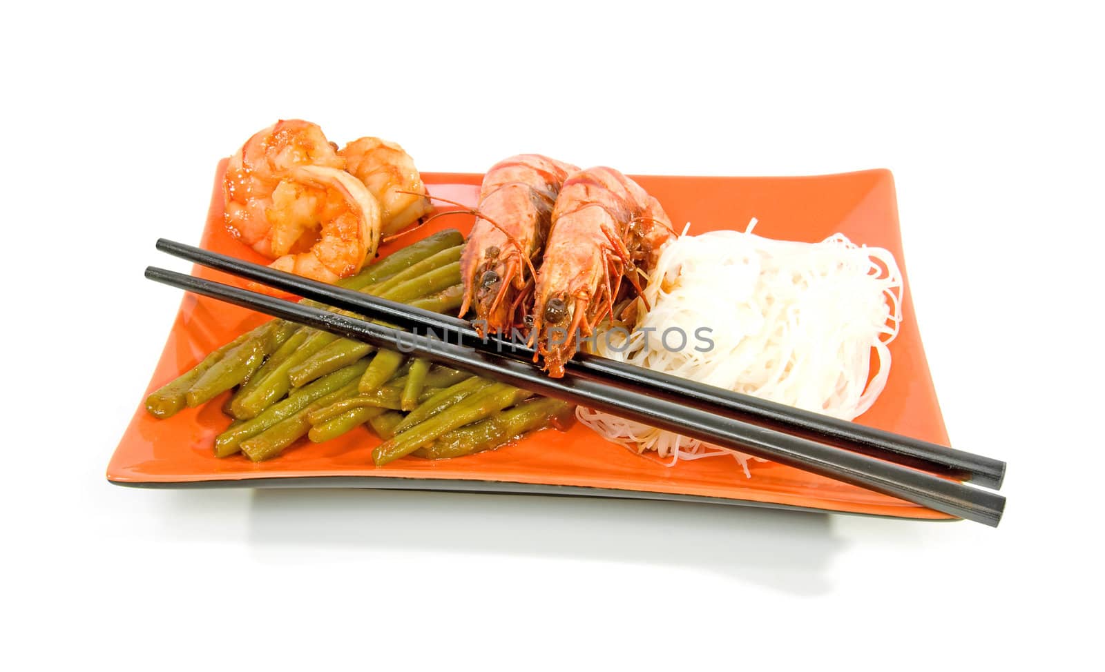 Oriental meal on orange plate isolated over white background