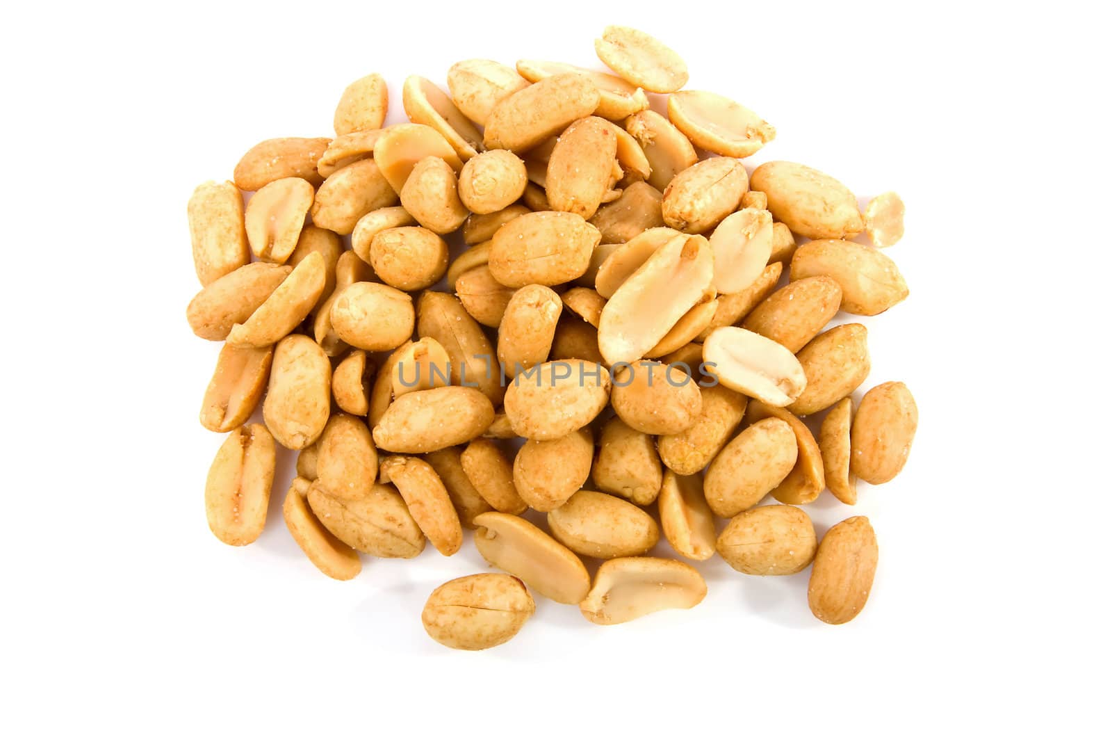 salted peanuts in closeup isolated over white background