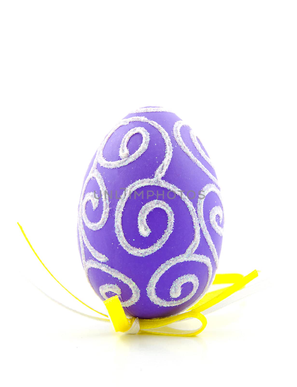One purple easter egg with yellow ribbon isolated on white background