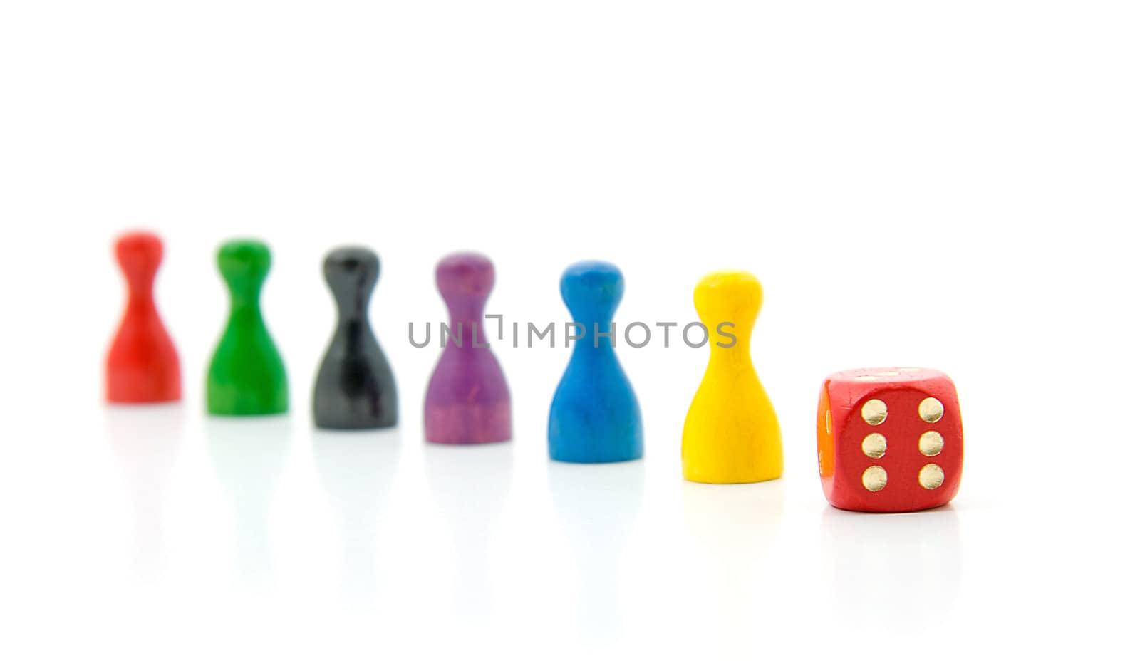 six colorful pawns with red dice over white background