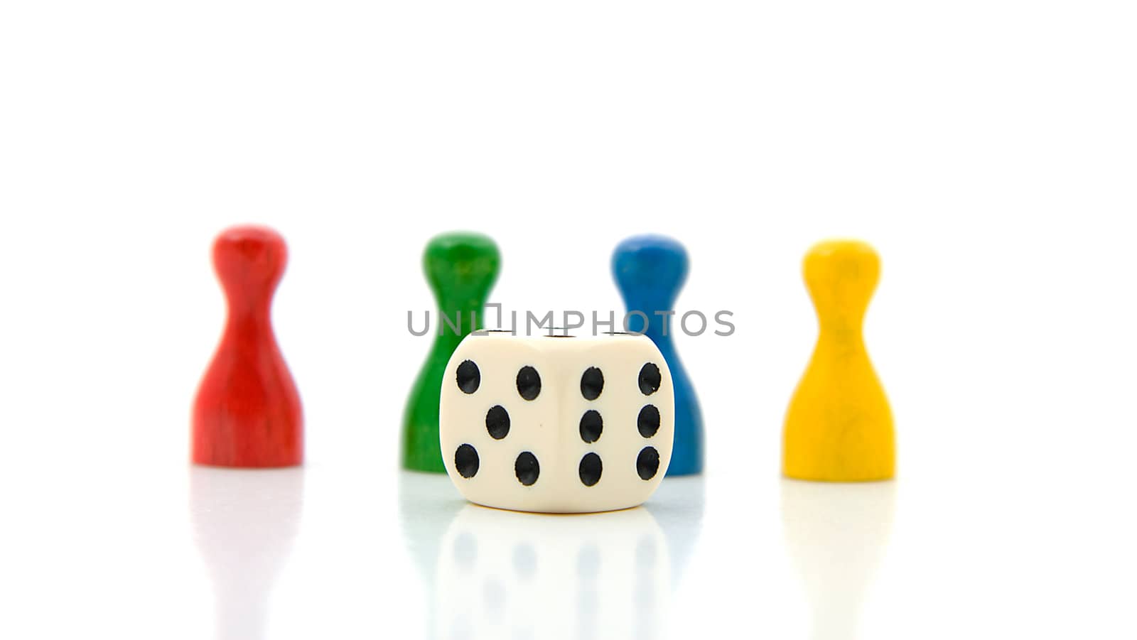four colorful pawns with white dice over white background