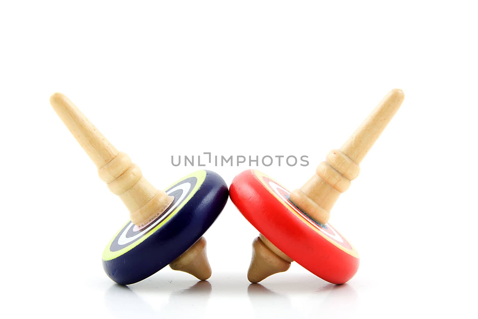 Two spinning tops isolated on white background