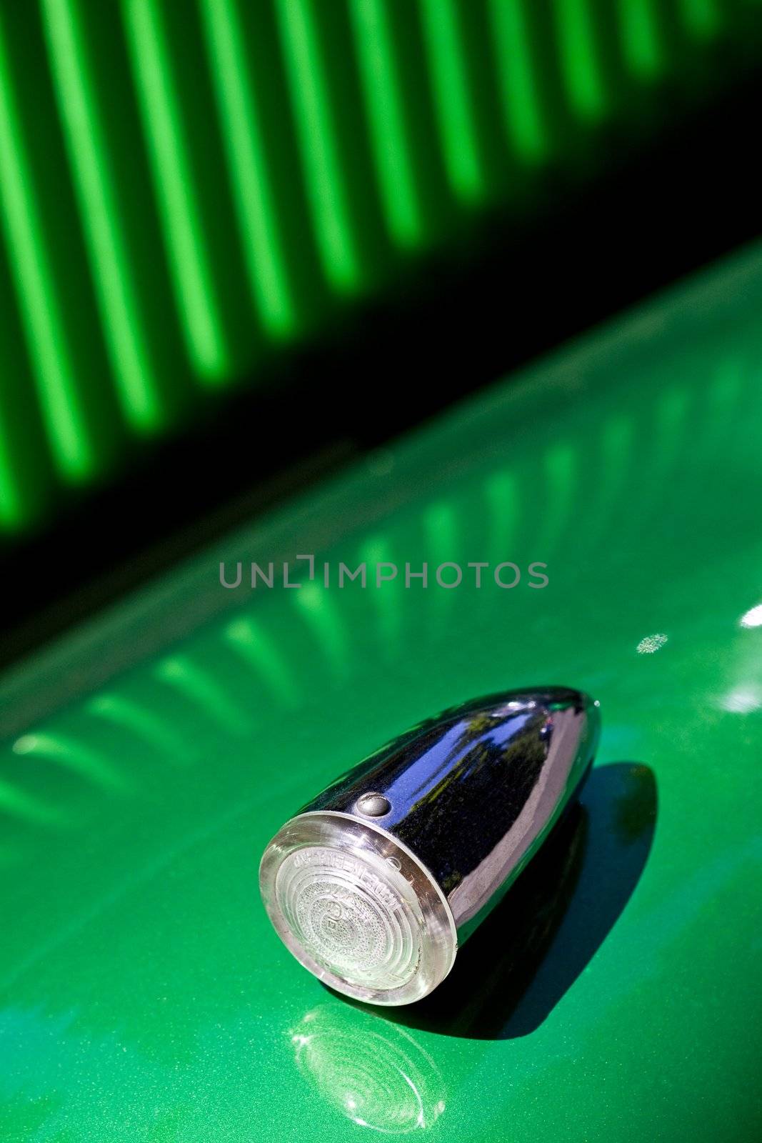 Closeup on turn signal of old shiny retro car