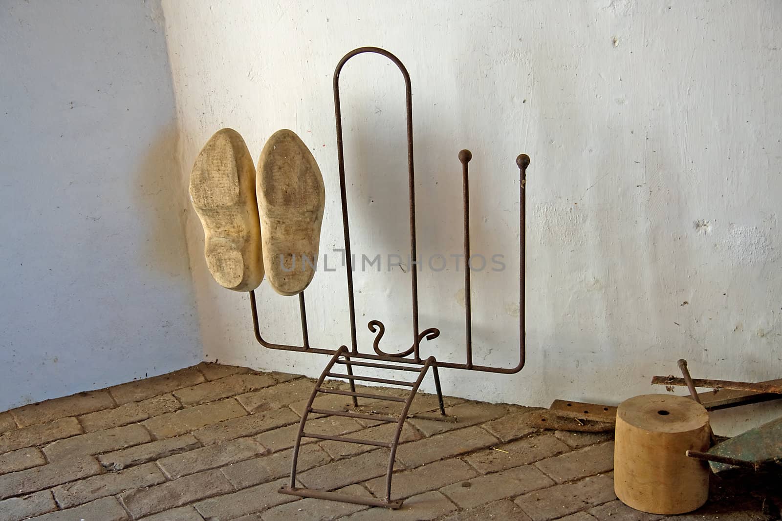 old parts and Dutch wooden shoed inside windmill