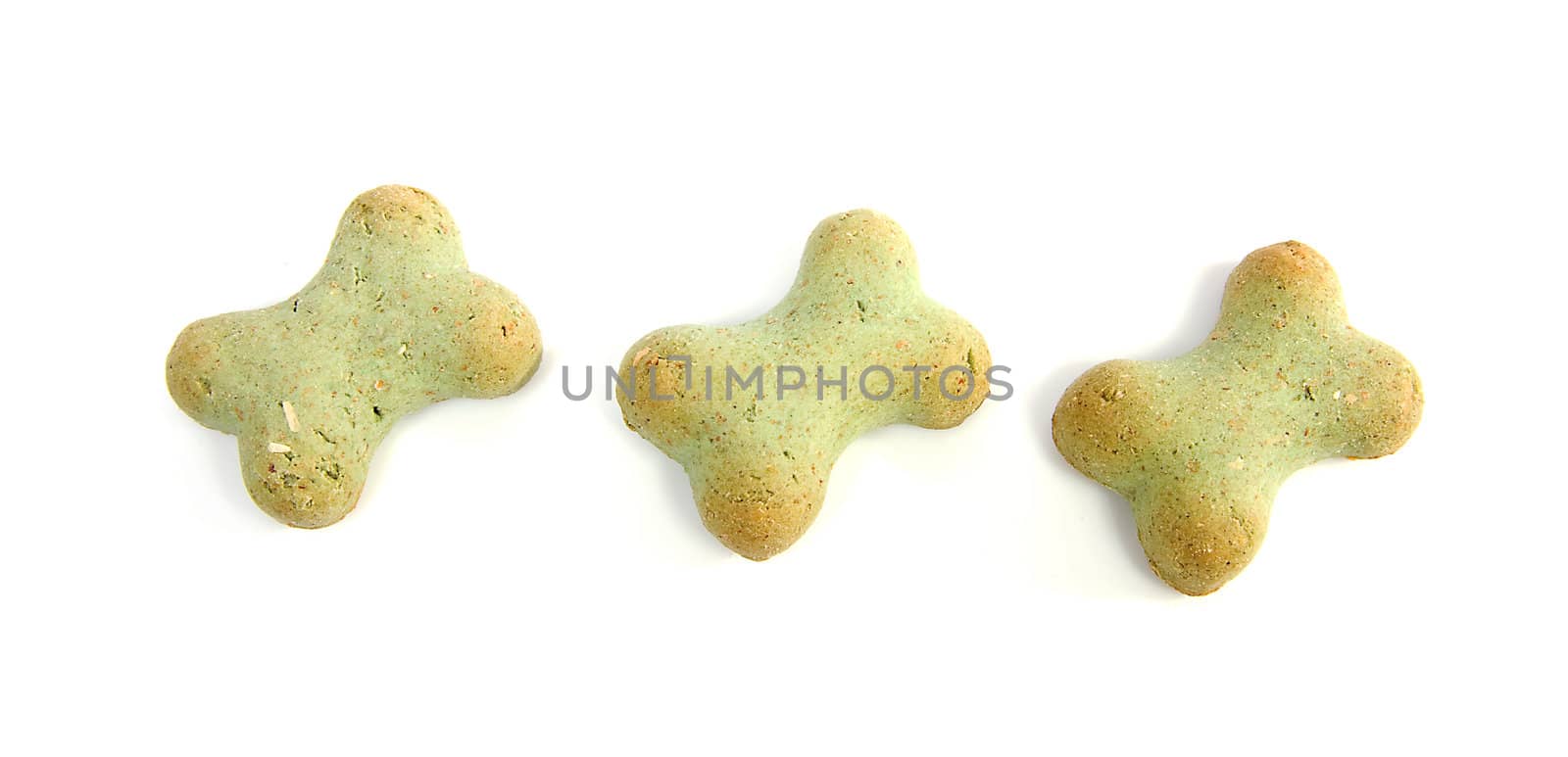 green dog cookies over white background