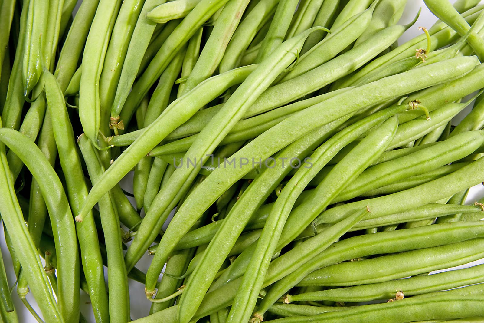 raw long green beans in closeup