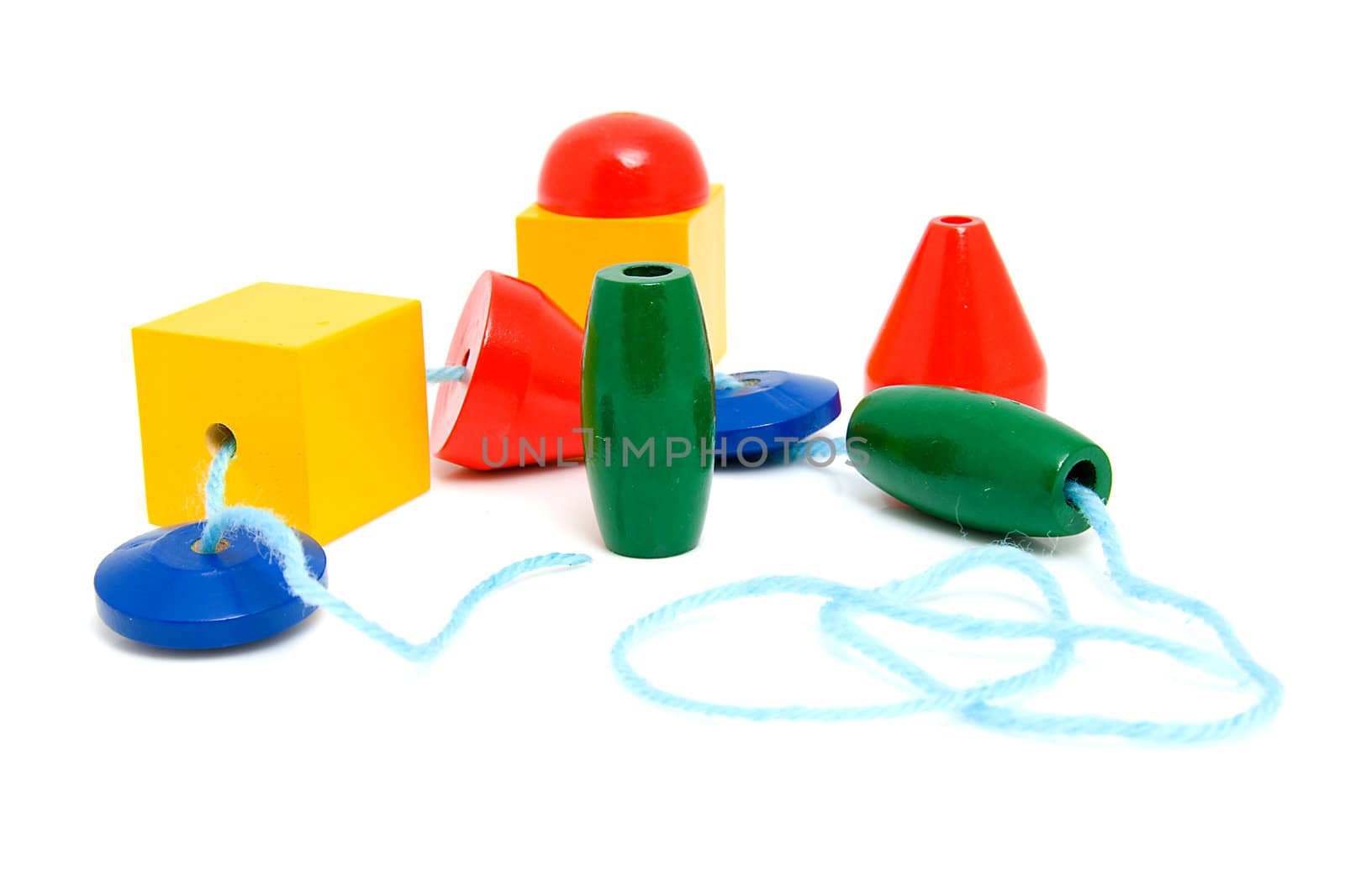 colorful wooden children's beads for necklase over white background