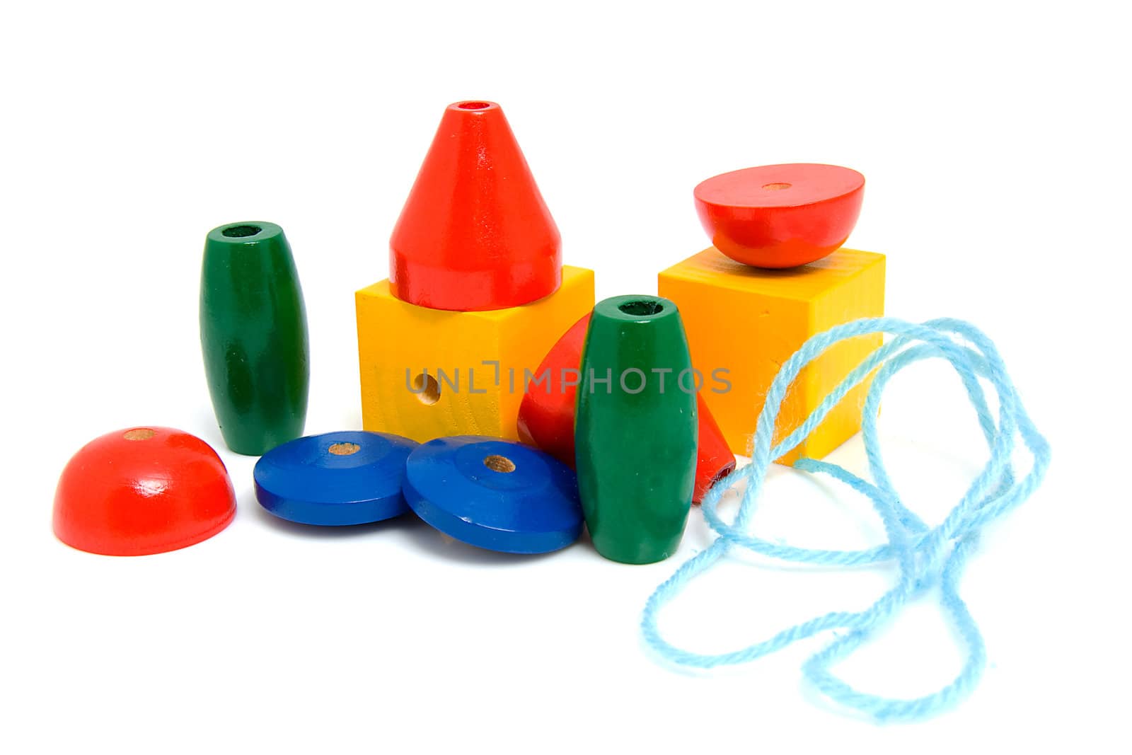 colorful wooden children's beads for necklase over white background