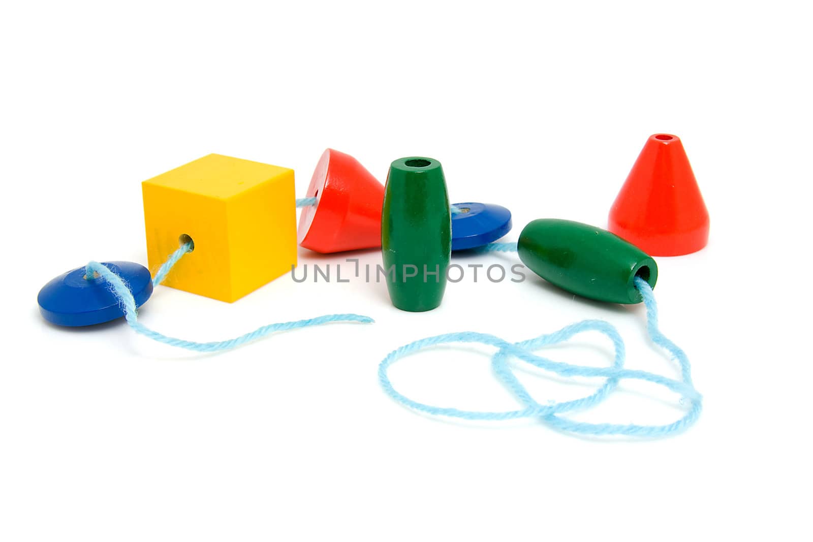 colorful wooden children's beads for necklase over white background