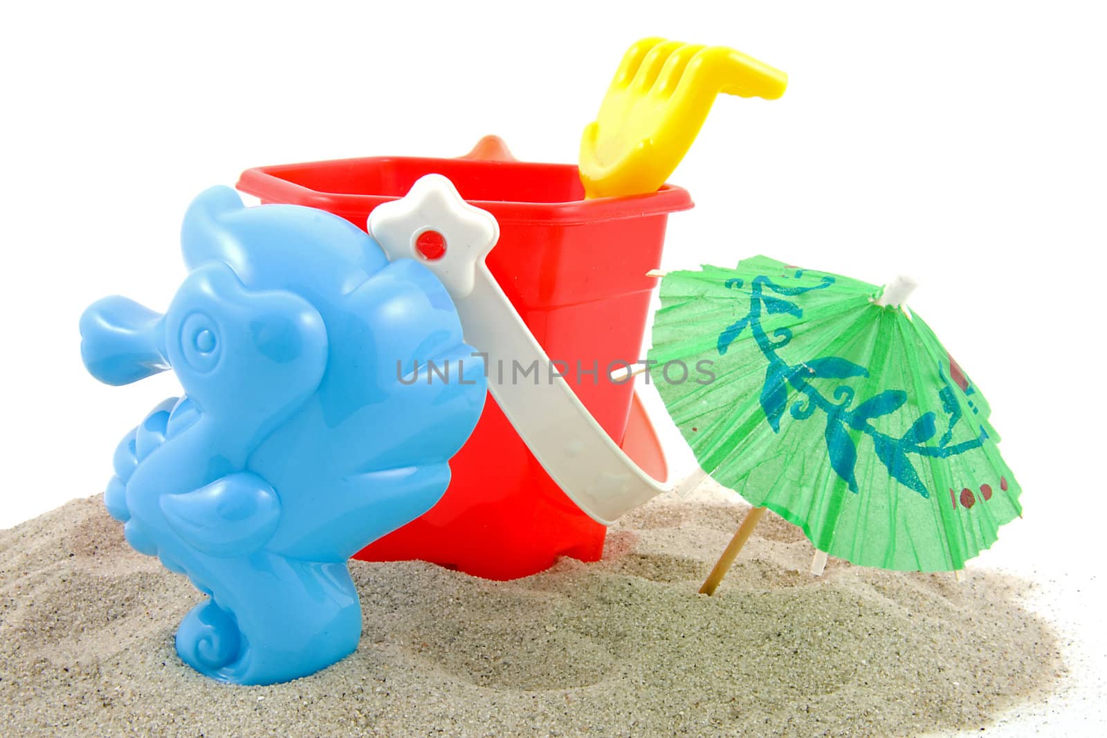 plastic play toys for at the beach over white background