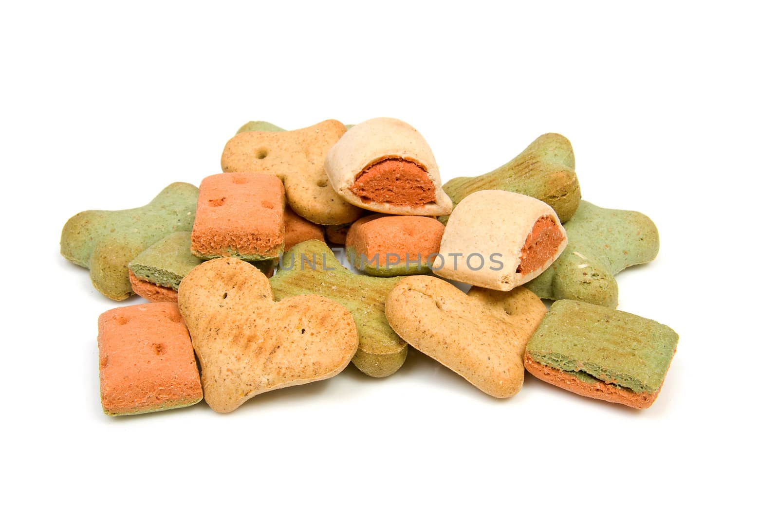 Stack of dog cookies over white background