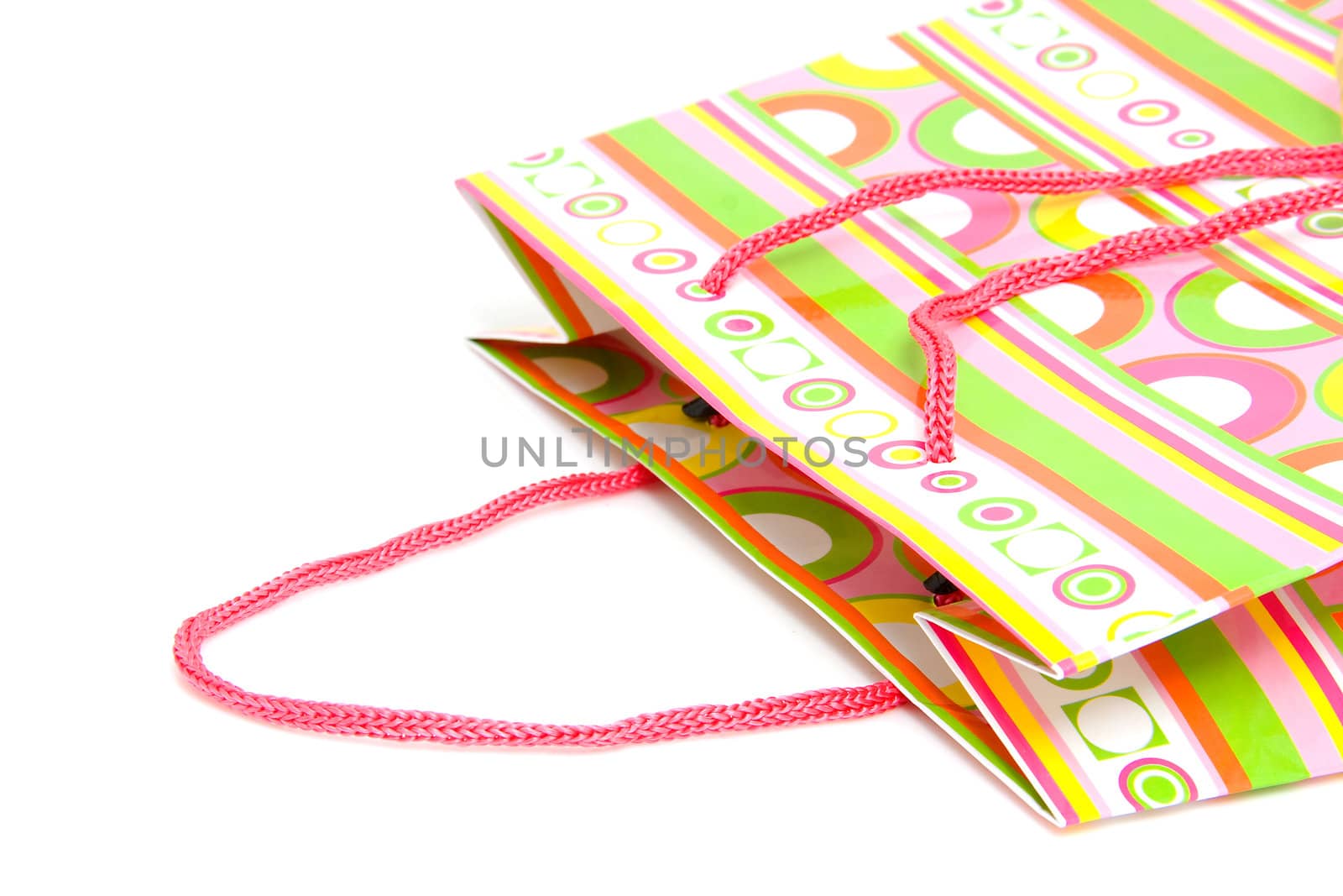Top of colorful shopping bag isolated on white background