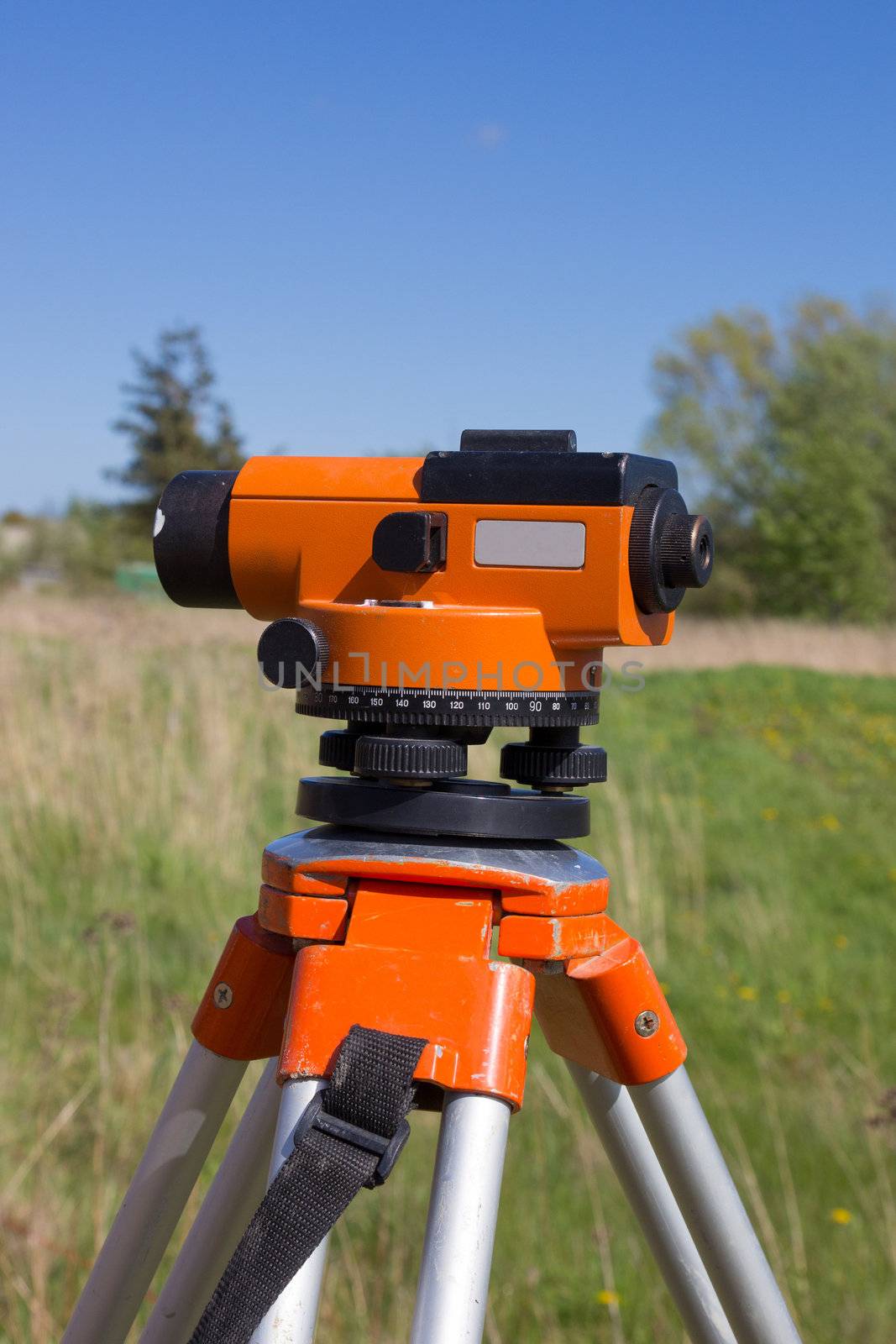 tool for surveyors - theodolite on tripod in outdoors