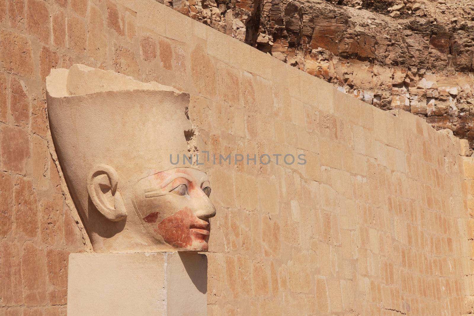 Face in ancient stone column by Gbuglok