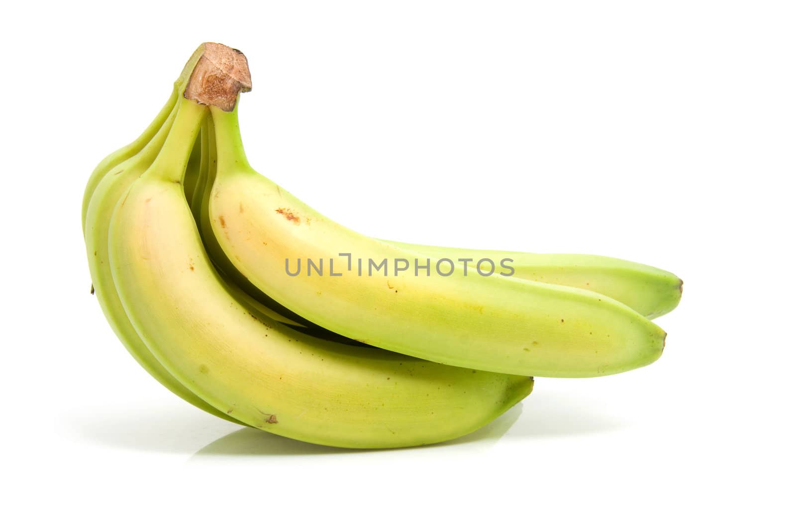 Spray of fresh green bananas isolated on white background