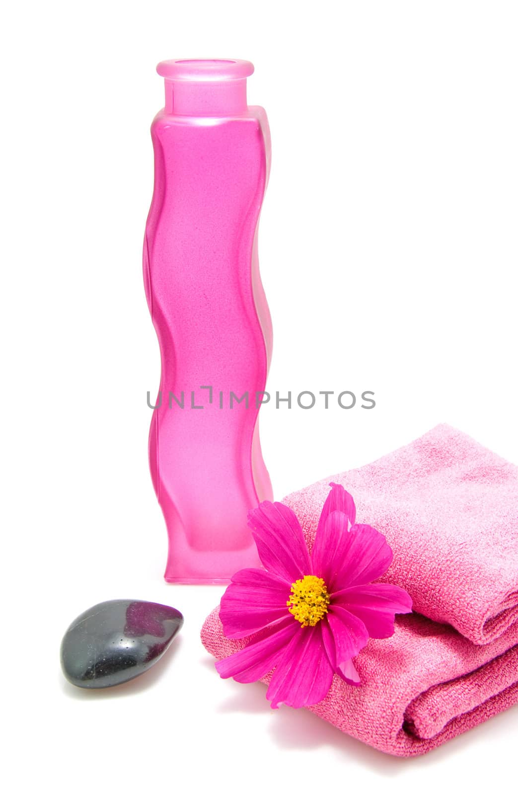 Pink bathroom accessory for spa over white background