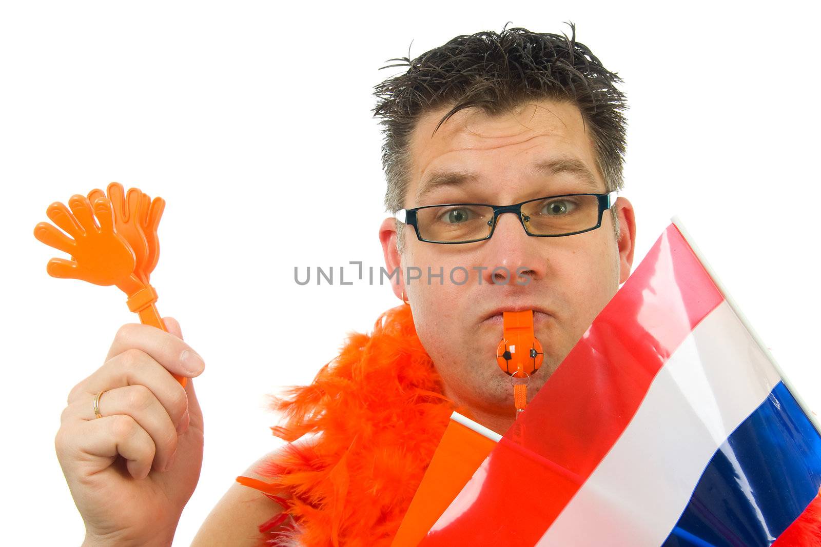 man is posing for soccer game with flag, flute and other accessories over white background