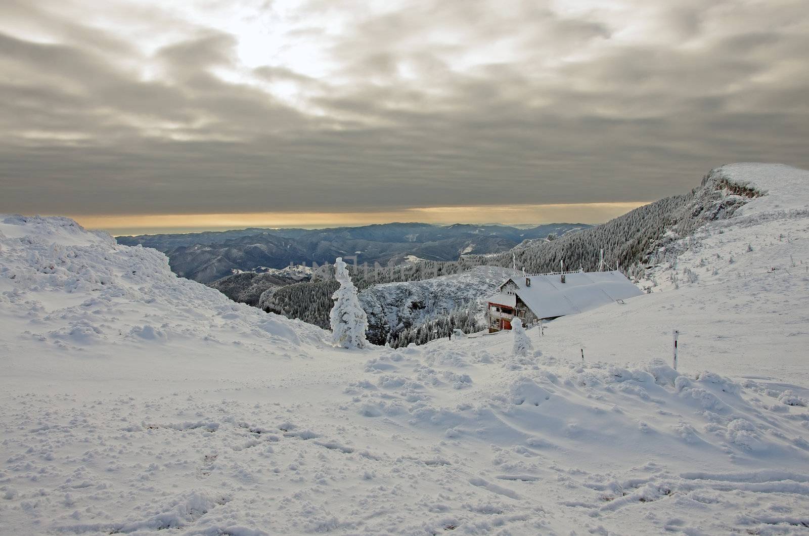 Winter landscape with shelter om Ceahlau mountain