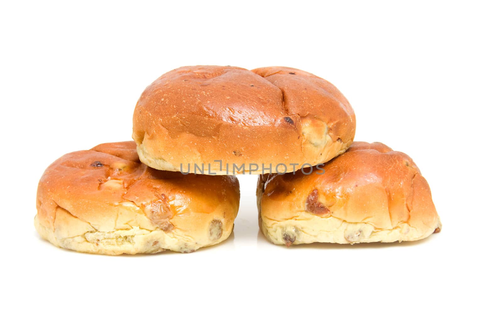 pile of raisin bread, also known as krentenbollen, isolated on white background