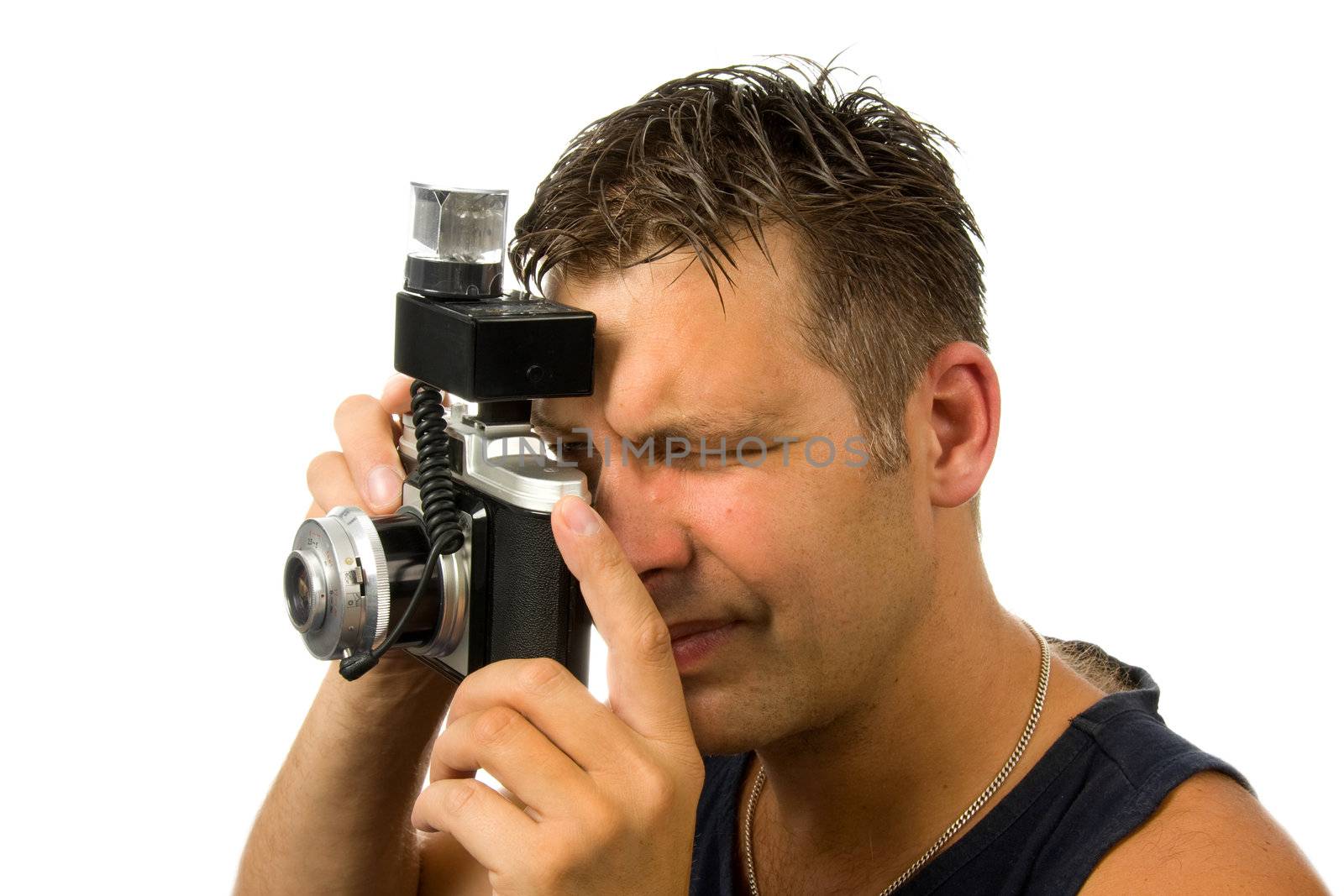 man is taking pictures with old fashioned photo camera over white background