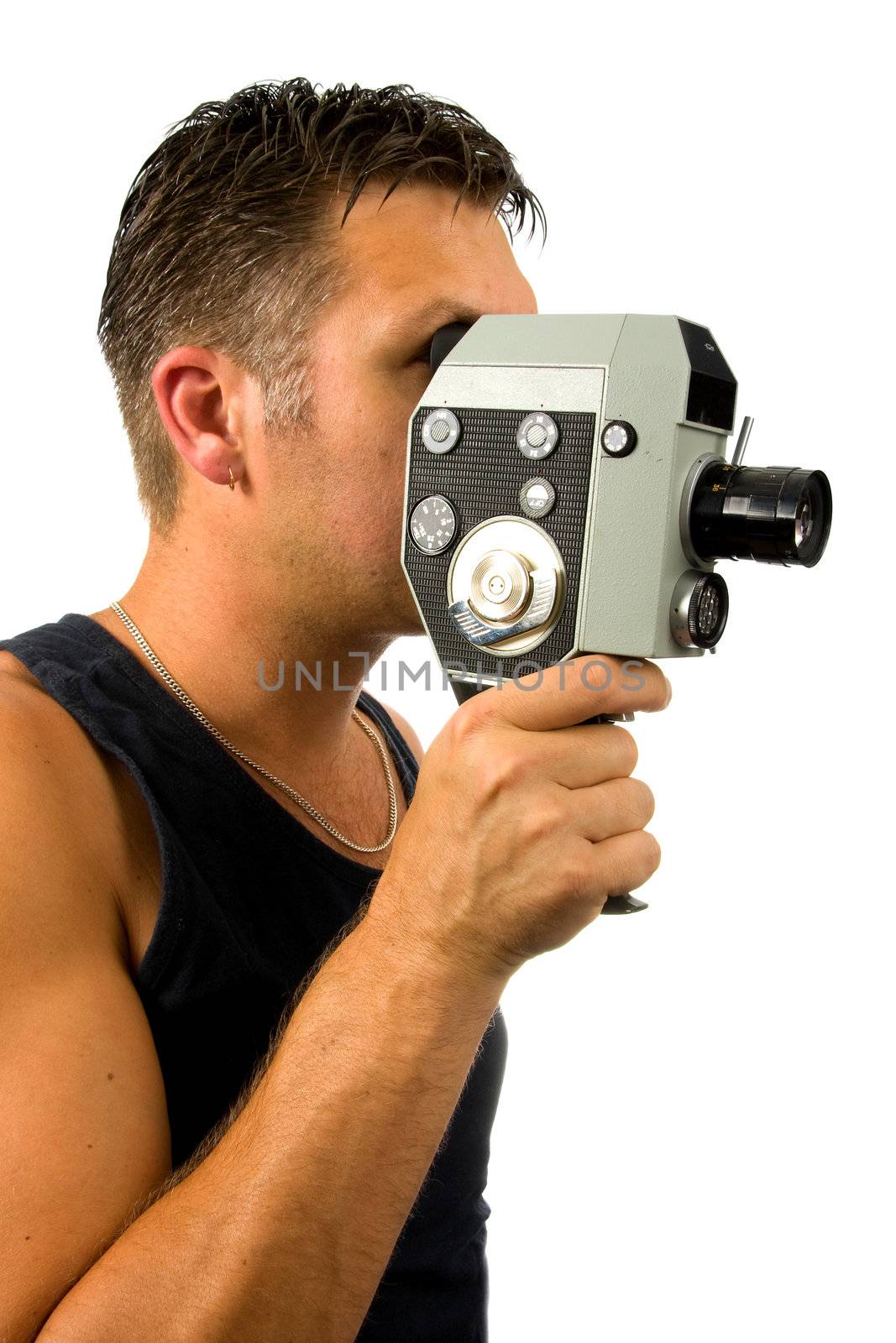 man is filming with old fashioned film camera over white background