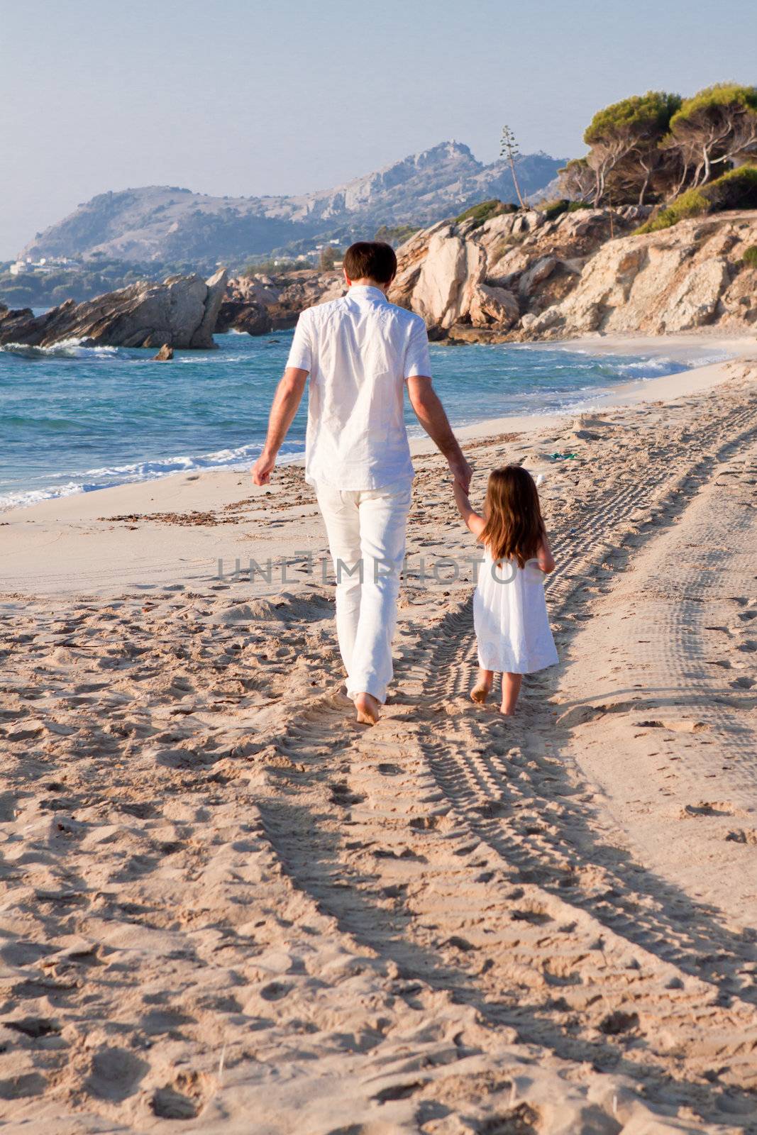 happy family father and daughter on beach having fun summer vacation