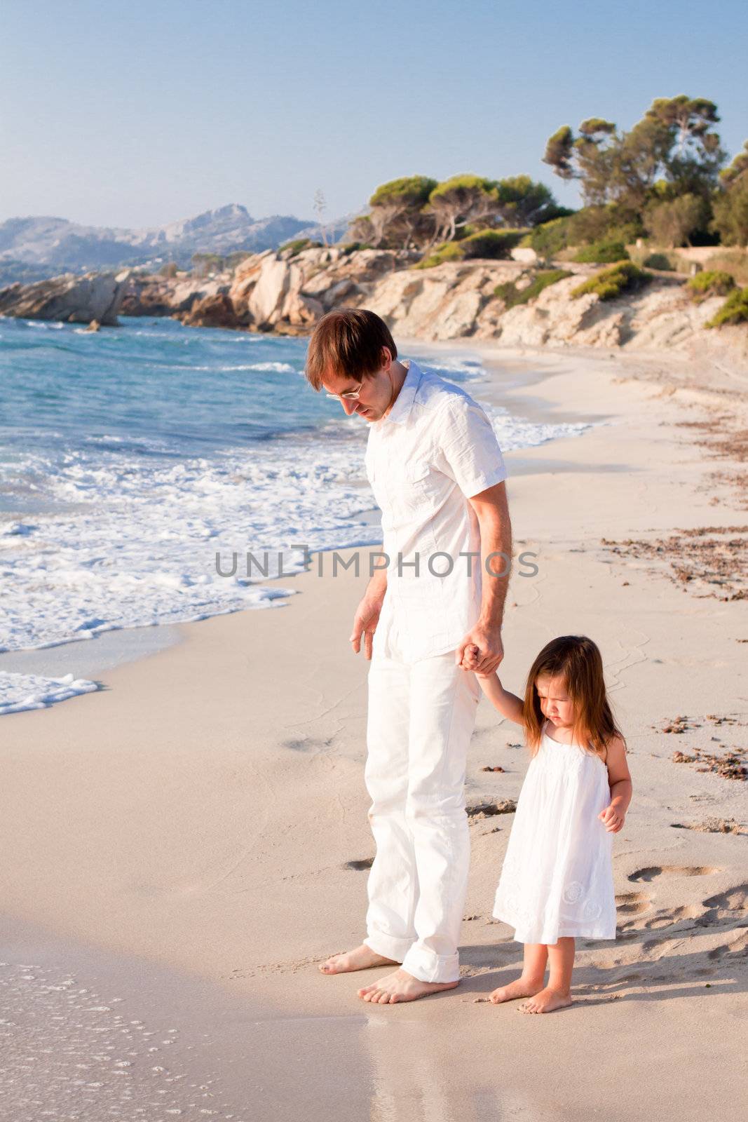 happy family father and daughter on beach having fun summer vacation