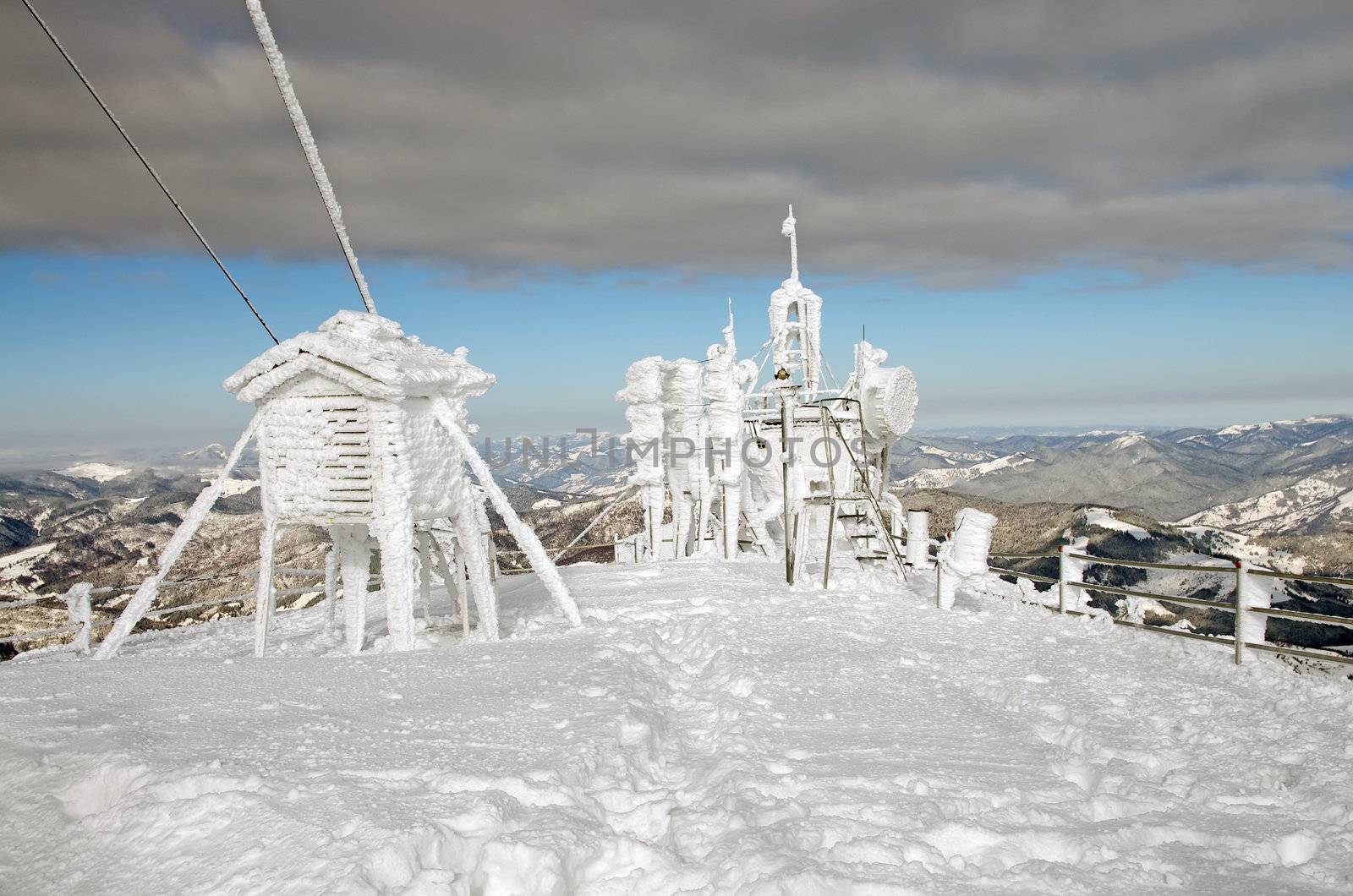 Frozen weather station on mountain top
