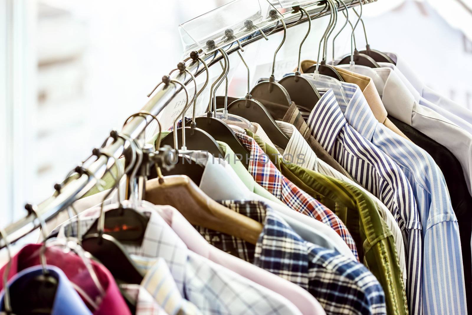 Shirts on hangers in the store