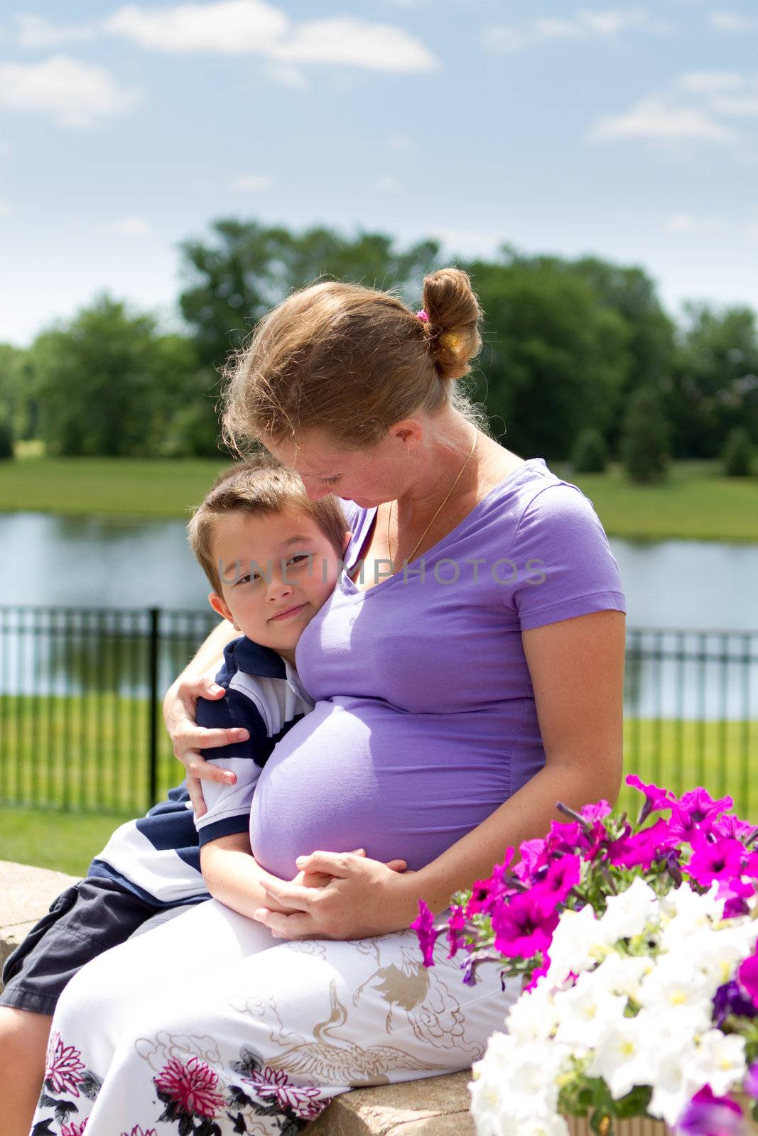 They are waiting for their new addition to their family. Big Brother knows his sister will be pretty.