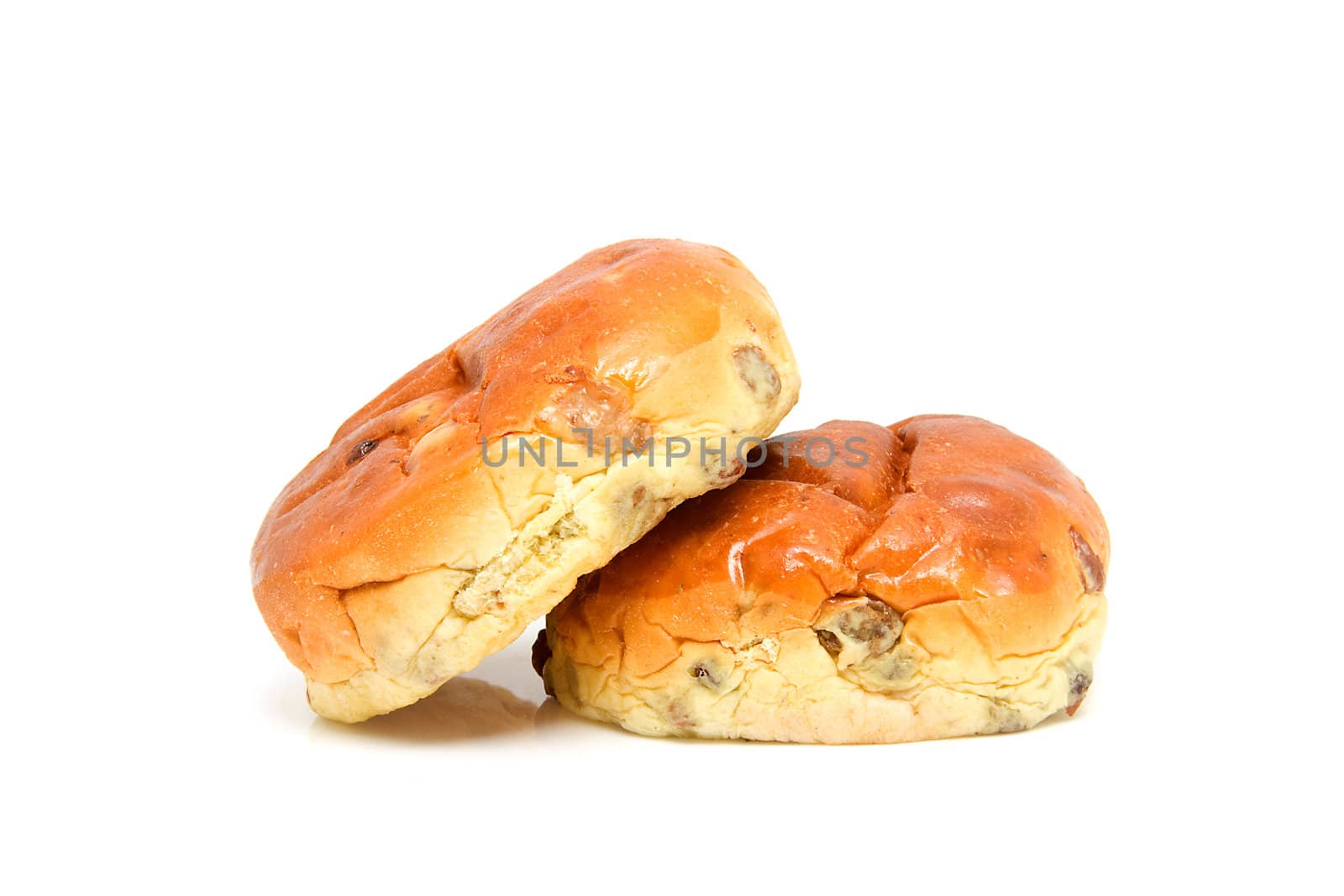 Two raising bread also known as Dutch krentenbol, isolated on white background