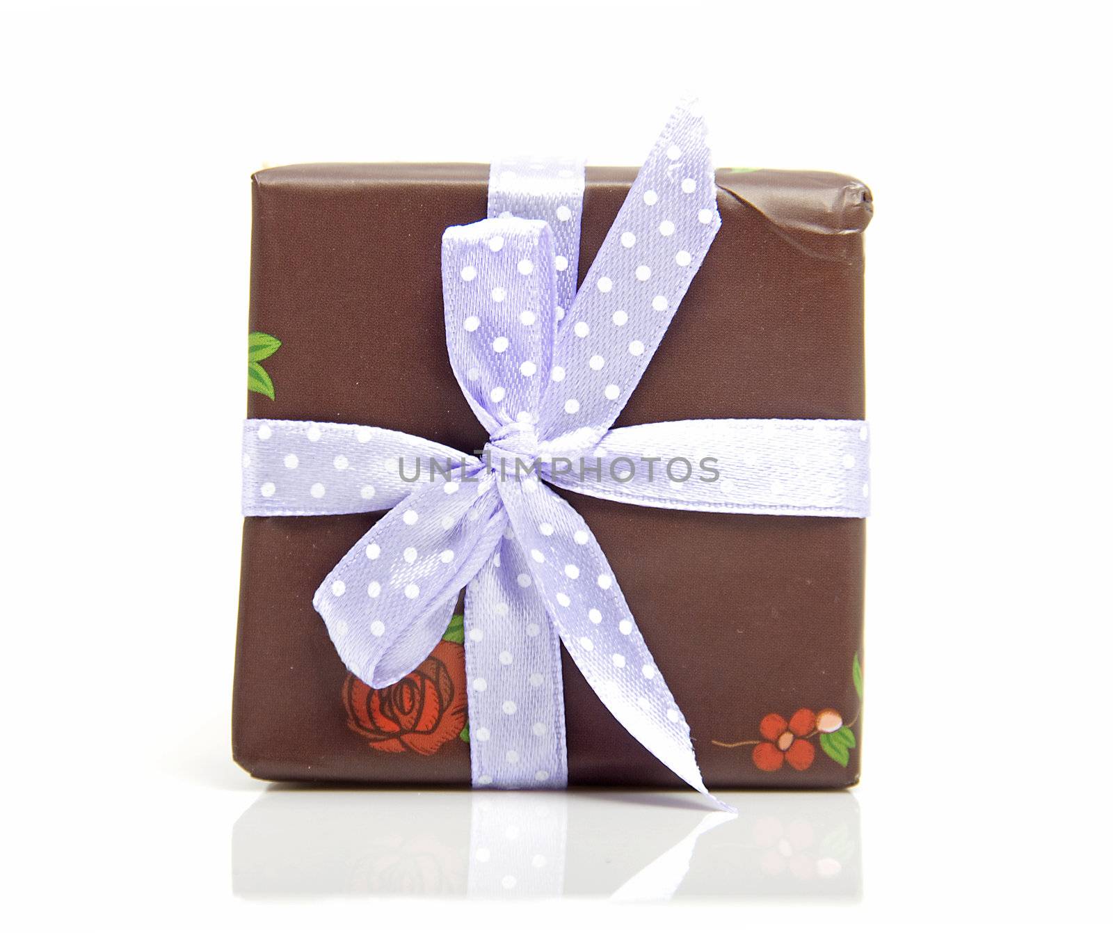 birthday present with purple bow over white background