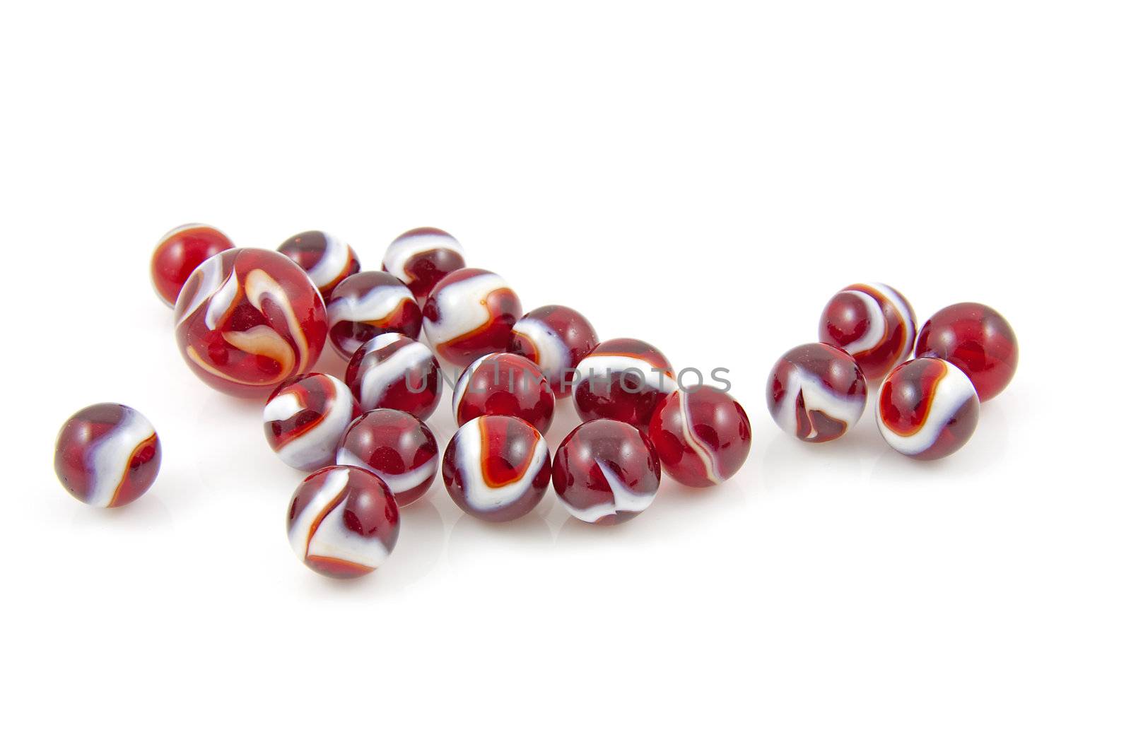 beautiful red colored shoot marbles isolated on white background