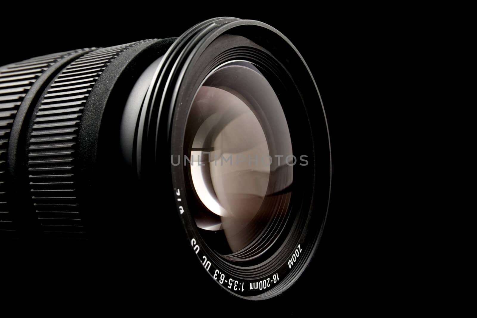 Closeup of camera lens over black background