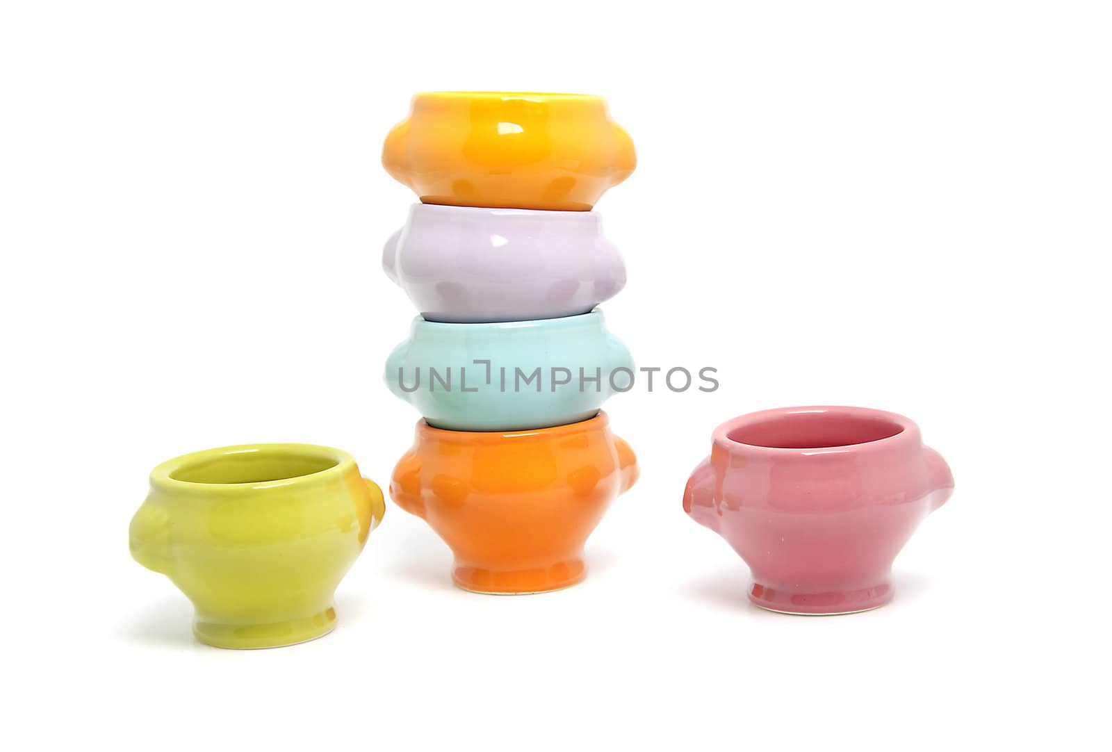 stack of colorful bowls isolated on white background