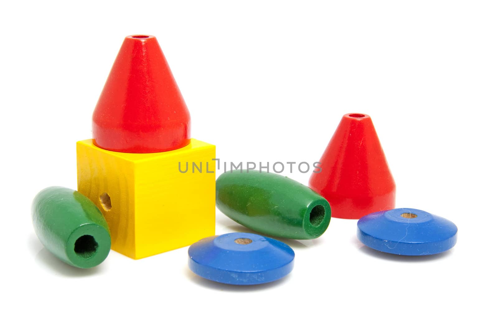 colorful wooden children's beads for necklase over white background