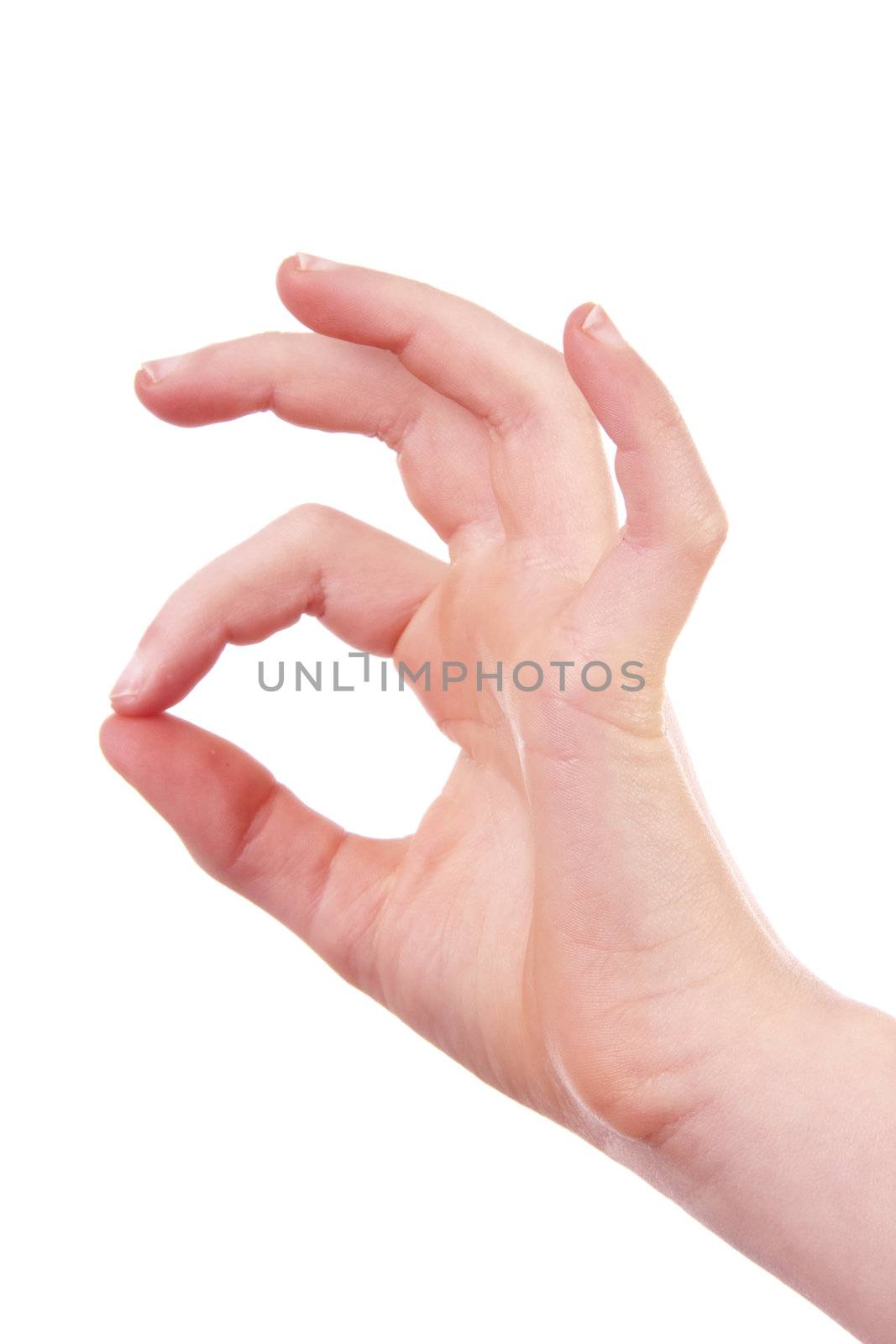 Kids hand is making OK sign over white background