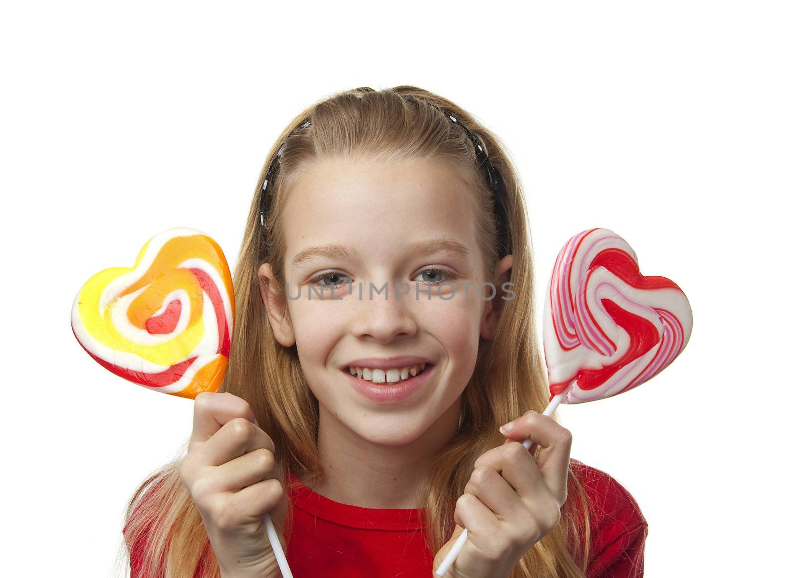 Young blonde girl with lollipops over white background
