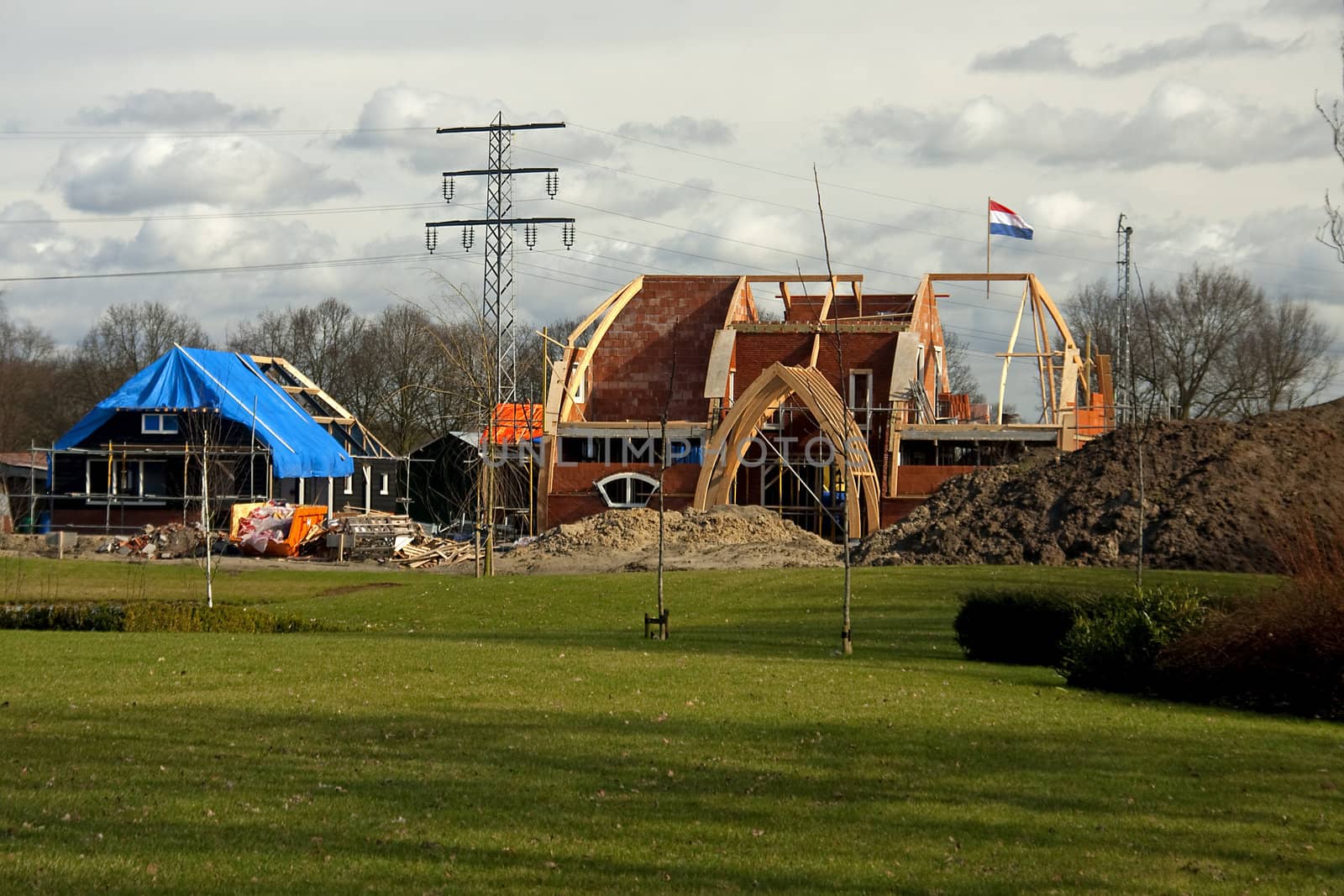 Building house and reached the top, put a flag on it, Dutch habit.