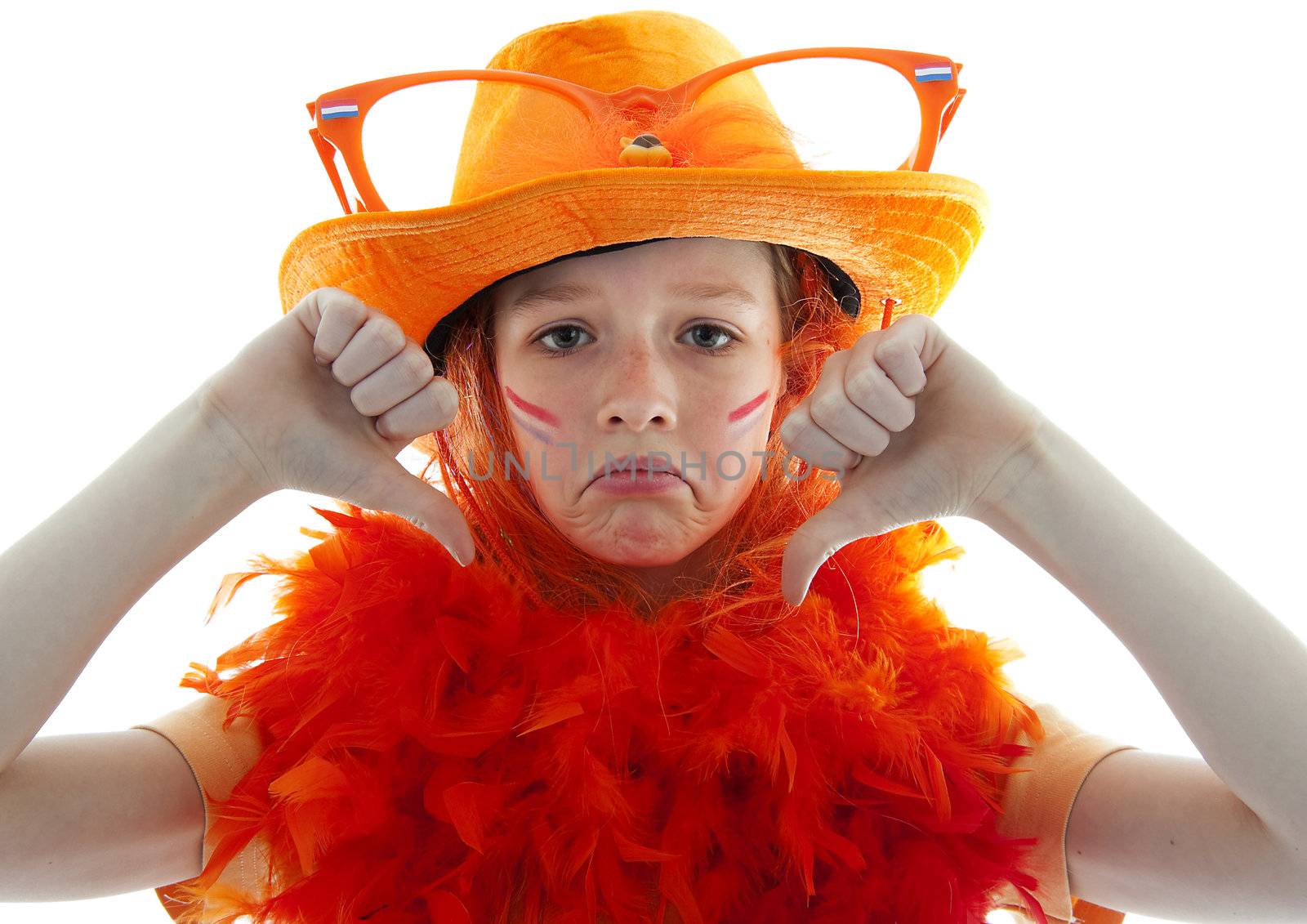 Unhappy soccer supporter: young blonde girl in orange outfit with thumbs down