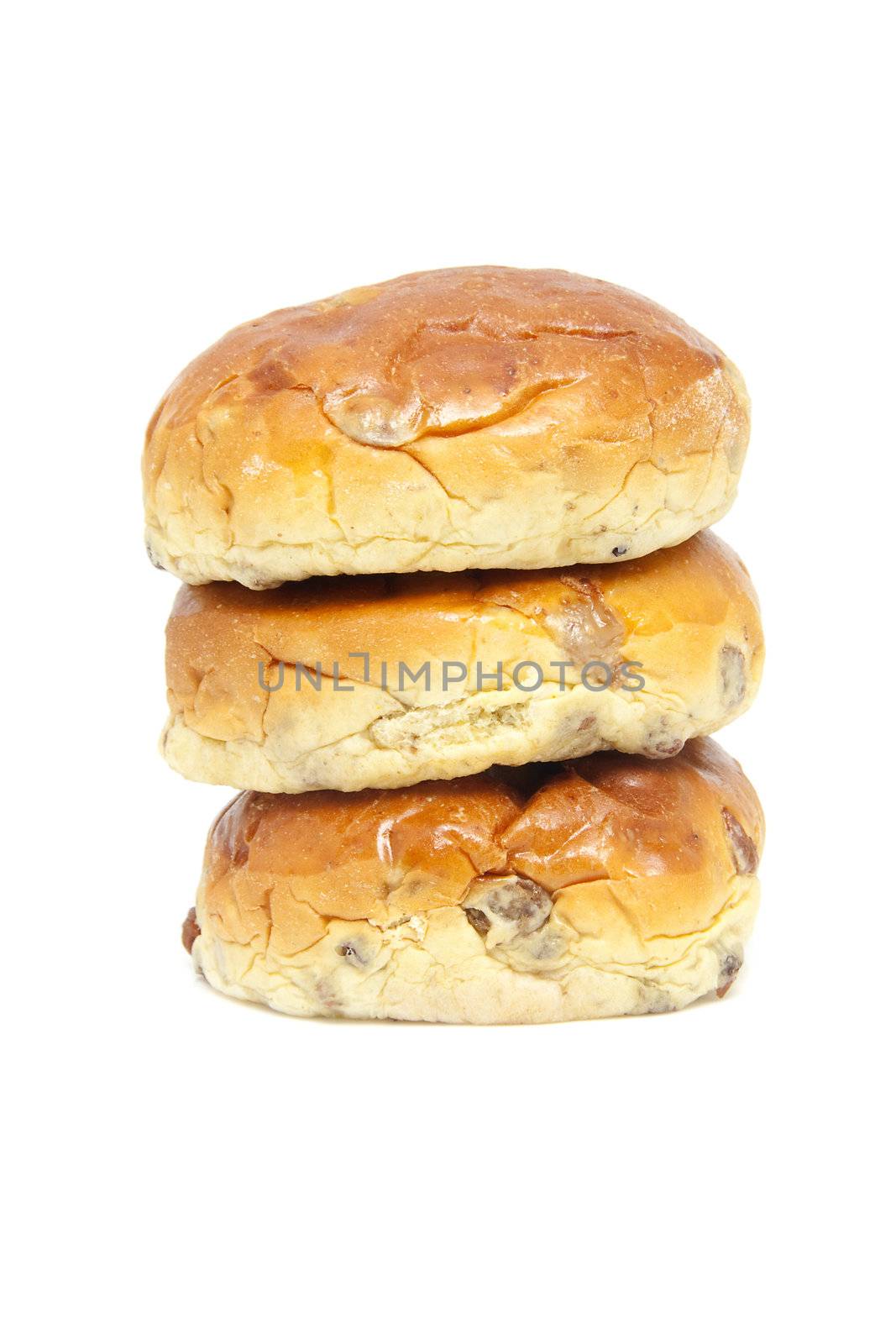 pile of raisin bread, also known as krentenbollen, isolated on white background