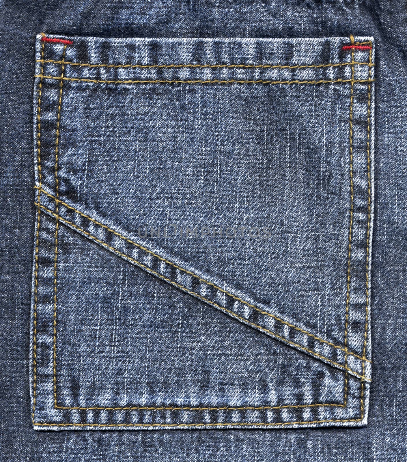 Colose up of blue jeans pocket.