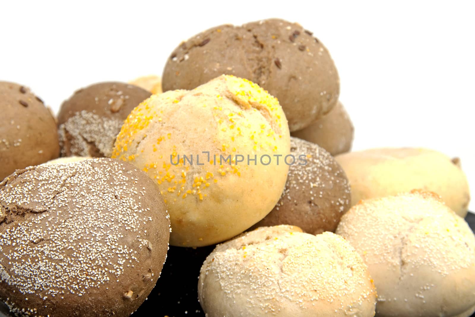 Stack of fresh baked buns over white background