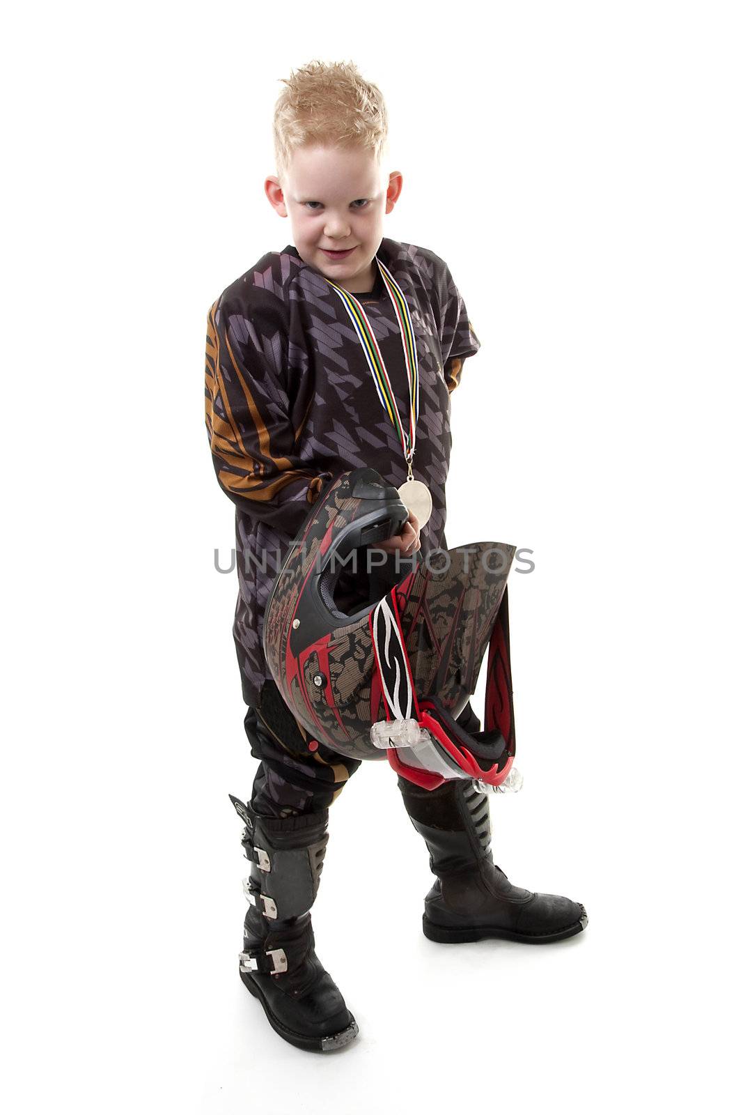 Young motor race boy is posing over white background