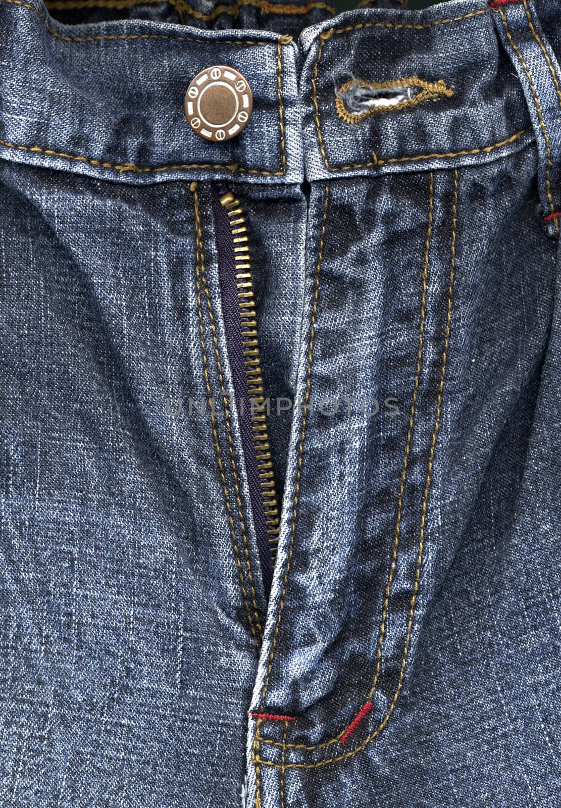 Detail of zipper on blue jeans by opasstudio