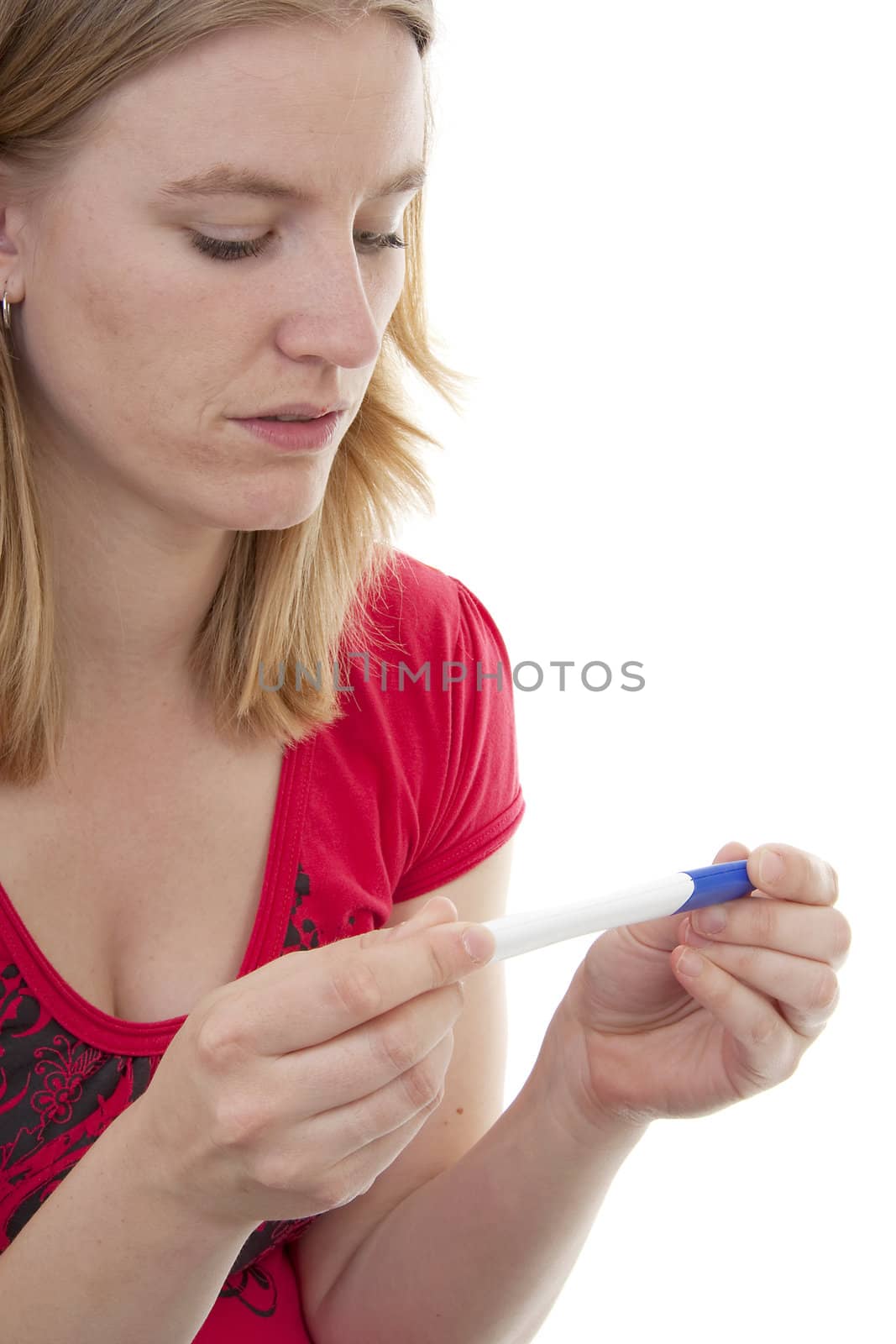 Woman with pregnancy tast is waiting for the result over white background