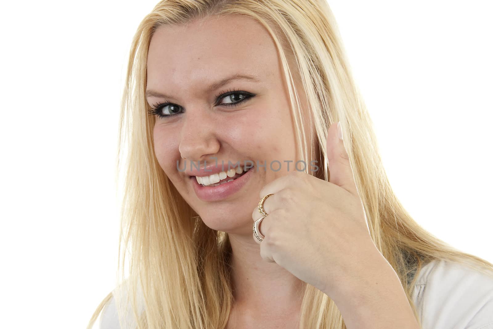 Young blonde woman with thumbs up over white background