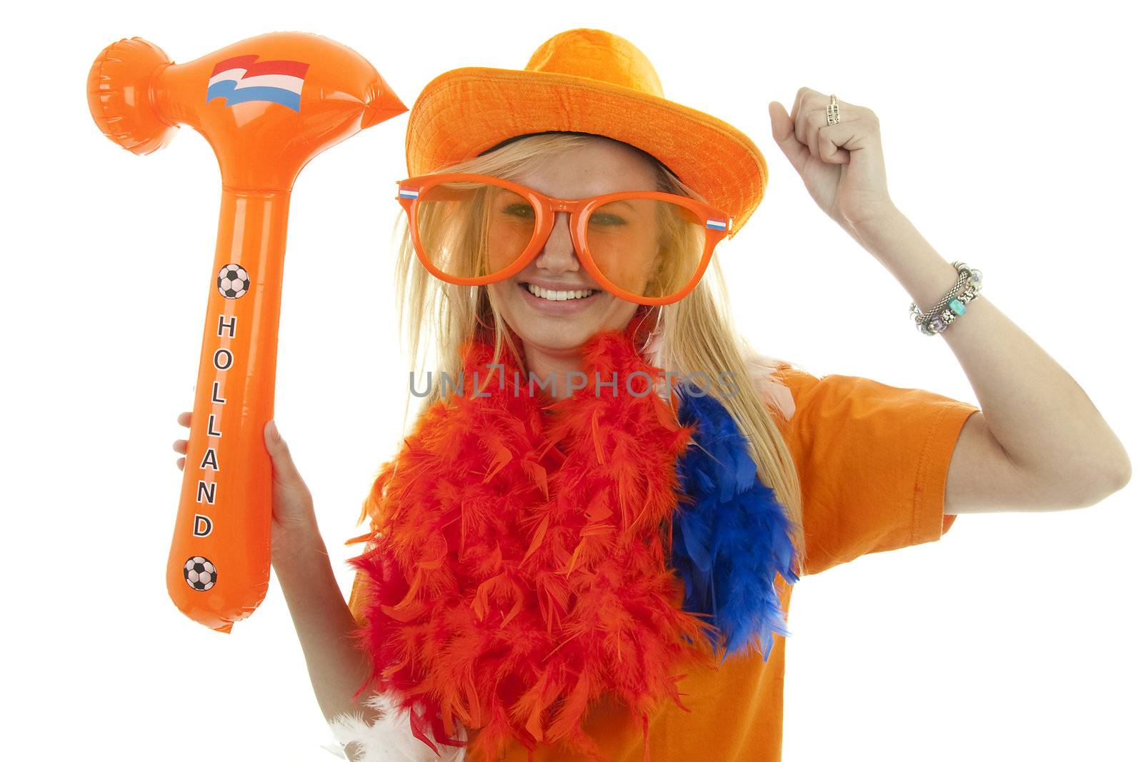 soccer supporter in orange outfit with blown up hammer over white background