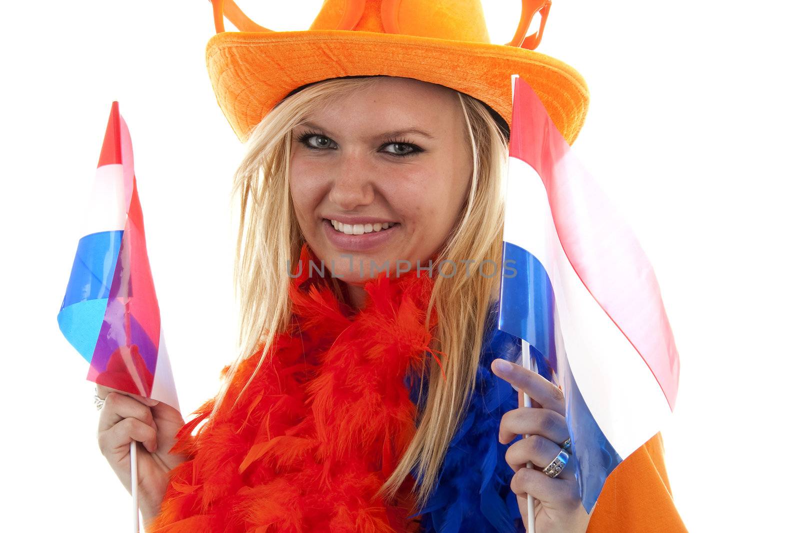 portrait of Dutch soccer fan in orange outfit with flags over white background