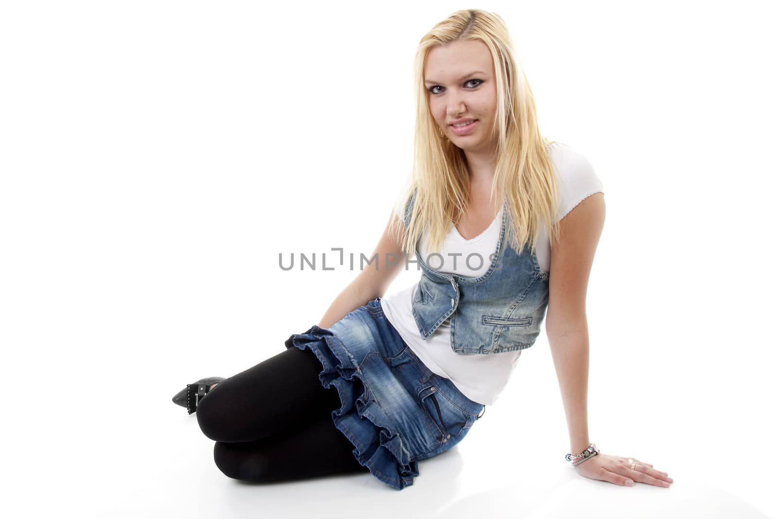 Young blonde woman is posing over white background